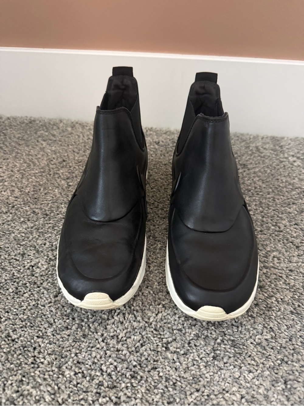 Nike Women’s Black Leather Slip-On Ankle Boots with White Sole.